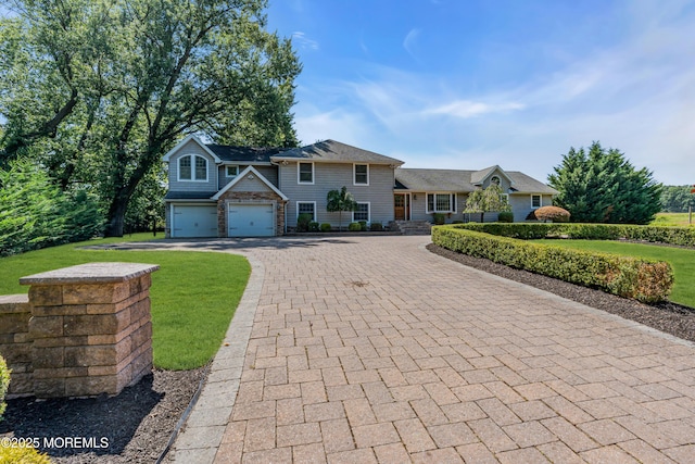 40 Centerville Rd, Holmdel, NJ 07733 - view of front of property with decorative driveway, a front yard, and a garage