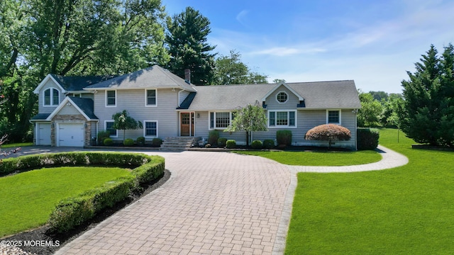 40 Centerville Rd, Holmdel, NJ 07733 - view of front of property with curved driveway, a front yard, and a garage