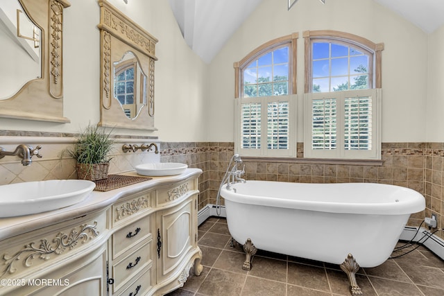 40 Centerville Rd, Holmdel, NJ 07733 - full bathroom featuring tile walls, double vanity, a wainscoted wall, lofted ceiling, and a baseboard radiator