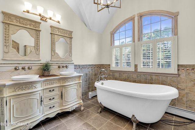 40 Centerville Rd, Holmdel, NJ 07733 - full bathroom with tile walls, wainscoting, double vanity, a soaking tub, and tile patterned floors