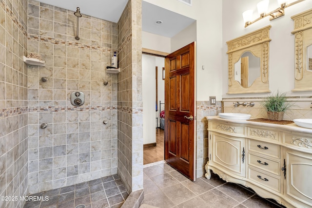 40 Centerville Rd, Holmdel, NJ 07733 - bathroom featuring double vanity, a walk in shower, tile patterned flooring, and tile walls