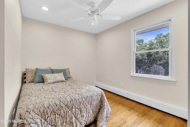 40 Centerville Rd, Holmdel, NJ 07733 - bedroom with a baseboard heating unit, recessed lighting, wood finished floors, and a ceiling fan