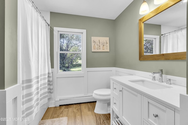 40 Centerville Rd, Holmdel, NJ 07733 - full bathroom featuring baseboard heating, wainscoting, vanity, and wood finished floors