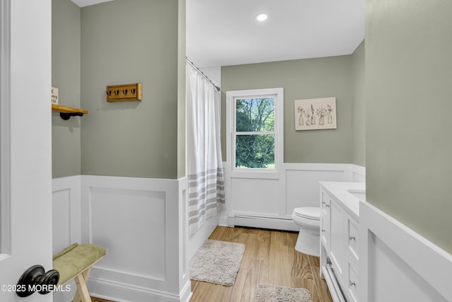40 Centerville Rd, Holmdel, NJ 07733 - full bathroom with a wainscoted wall, baseboard heating, wood finished floors, a decorative wall, and vanity
