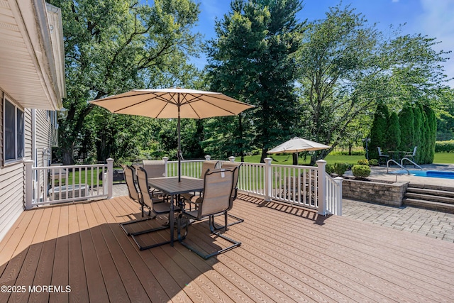 40 Centerville Rd, Holmdel, NJ 07733 - deck featuring an outdoor pool, outdoor dining space, and view of scattered trees