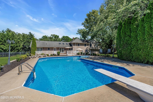 40 Centerville Rd, Holmdel, NJ 07733 - view of swimming pool featuring a patio, a diving board, view of scattered trees, and a deck