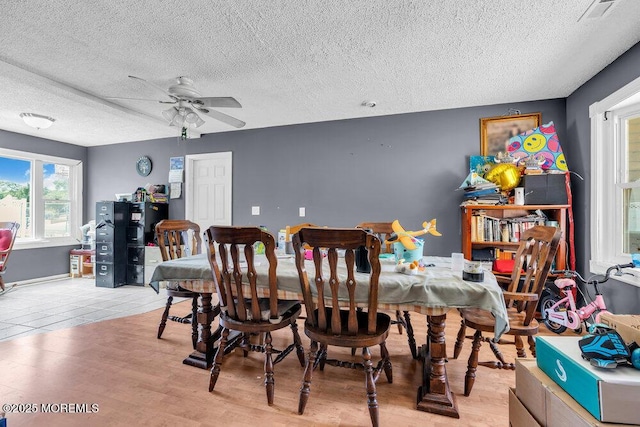 720 Weehawken Ave, Forked River, NJ 08731 - dining area featuring a textured ceiling, a ceiling fan, and light wood-style floors