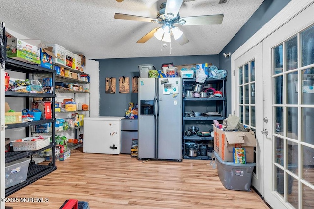 720 Weehawken Ave, Forked River, NJ 08731 - kitchen featuring refrigerator with ice dispenser, a textured ceiling, refrigerator, ceiling fan, and wood finished floors