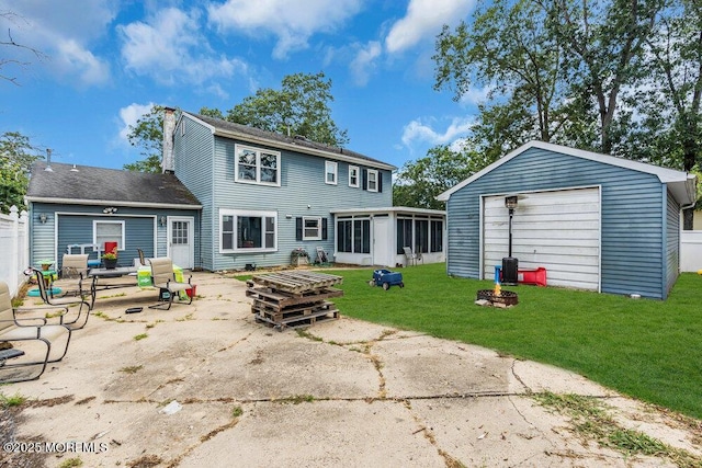 720 Weehawken Ave, Forked River, NJ 08731 - rear view of property featuring a sunroom, a lawn, a chimney, a patio area, and an outbuilding
