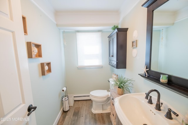 1920 Kenilworth Ct, Toms River, NJ 08753 - bathroom with a baseboard heating unit, wood finished floors, and crown molding