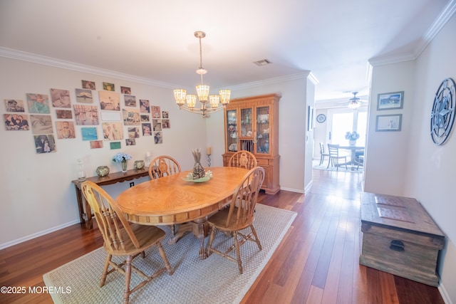 1920 Kenilworth Ct, Toms River, NJ 08753 - dining room with a chandelier, crown molding, wood finished floors, and a ceiling fan