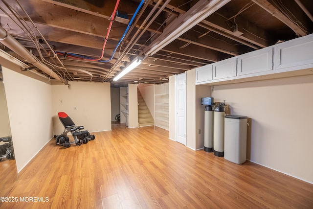 1920 Kenilworth Ct, Toms River, NJ 08753 - finished basement featuring a water softener system, stairs, and light wood-style flooring