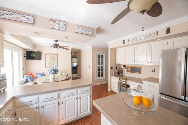 1920 Kenilworth Ct, Toms River, NJ 08753 - kitchen with freestanding refrigerator, ceiling fan, wood finished floors, ornamental molding, and white cabinets