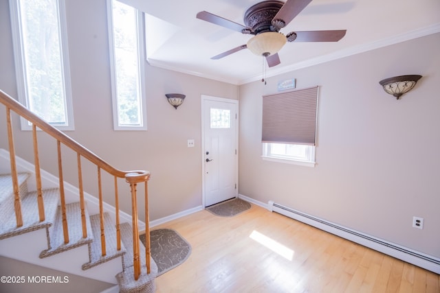 1920 Kenilworth Ct, Toms River, NJ 08753 - foyer entrance with baseboard heating, wood finished floors, crown molding, stairs, and ceiling fan