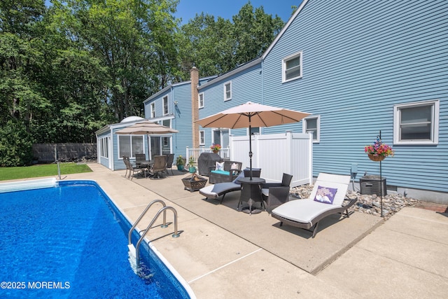 1920 Kenilworth Ct, Toms River, NJ 08753 - view of swimming pool featuring a patio, outdoor dining area, a fire pit, and an outdoor structure