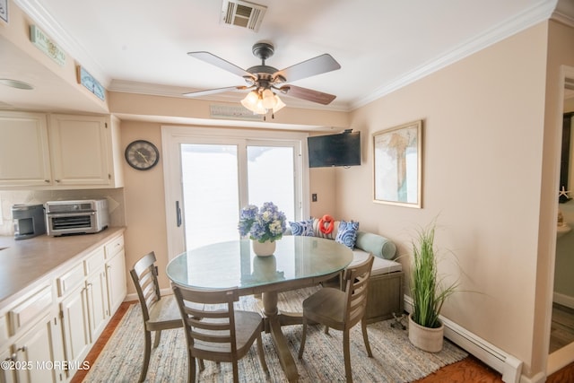 1920 Kenilworth Ct, Toms River, NJ 08753 - dining room with a baseboard radiator, light wood-type flooring, a ceiling fan, plenty of natural light, and crown molding