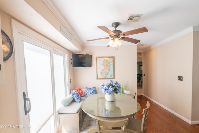 1920 Kenilworth Ct, Toms River, NJ 08753 - dining room featuring plenty of natural light, crown molding, wood finished floors, and a ceiling fan