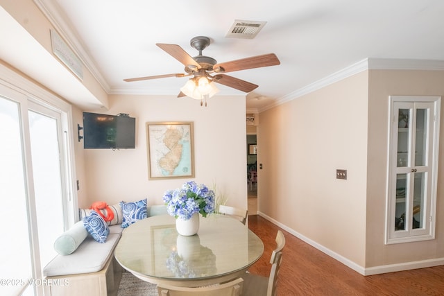 1920 Kenilworth Ct, Toms River, NJ 08753 - dining area with wood finished floors, ornamental molding, and a ceiling fan