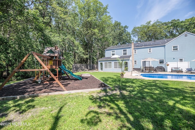 1920 Kenilworth Ct, Toms River, NJ 08753 - rear view of house featuring a fenced backyard, a patio area, and a playground