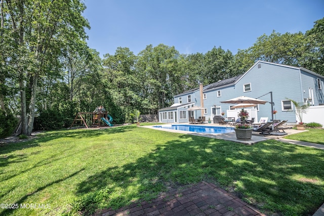 1920 Kenilworth Ct, Toms River, NJ 08753 - rear view of property featuring a patio and a playground