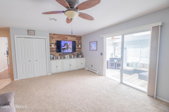 1920 Kenilworth Ct, Toms River, NJ 08753 - unfurnished living room with a baseboard heating unit, a ceiling fan, and light carpet