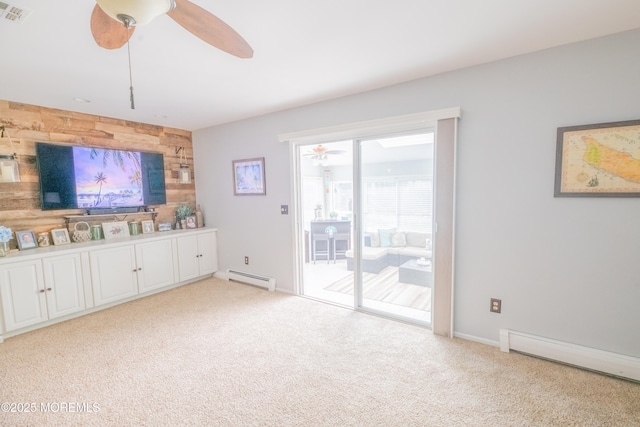 1920 Kenilworth Ct, Toms River, NJ 08753 - unfurnished living room featuring baseboard heating, a ceiling fan, carpet floors, and wood walls