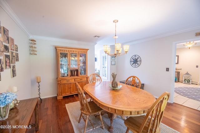 1920 Kenilworth Ct, Toms River, NJ 08753 - dining area with a chandelier, dark wood-style floors, and ornamental molding