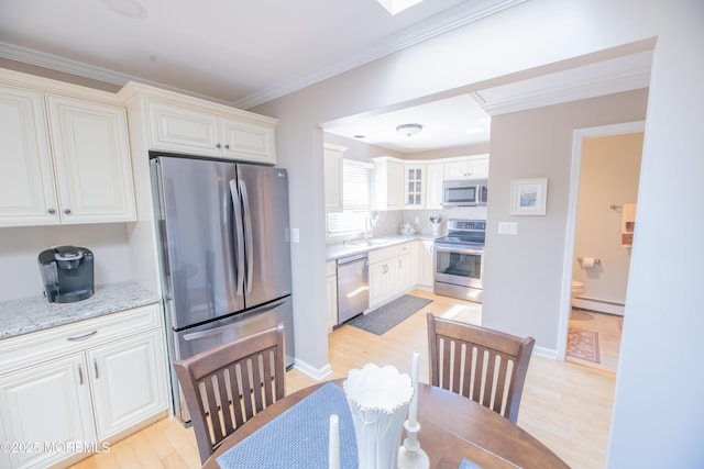 1920 Kenilworth Ct, Toms River, NJ 08753 - kitchen with appliances with stainless steel finishes, a baseboard heating unit, ornamental molding, light wood-style flooring, and white cabinetry