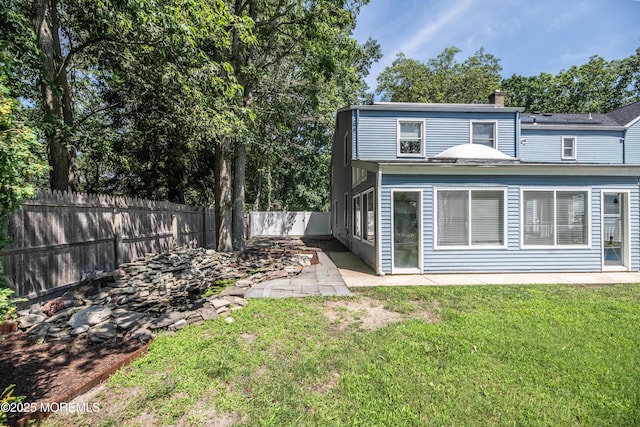1920 Kenilworth Ct, Toms River, NJ 08753 - rear view of property featuring a fenced backyard, a patio, and a chimney