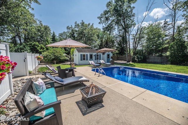 1920 Kenilworth Ct, Toms River, NJ 08753 - view of swimming pool featuring a patio area, an outdoor structure, an outdoor fire pit, and a fenced backyard