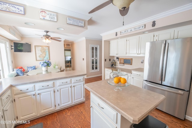 1920 Kenilworth Ct, Toms River, NJ 08753 - kitchen with freestanding refrigerator, ceiling fan, a kitchen island, light countertops, and ornamental molding