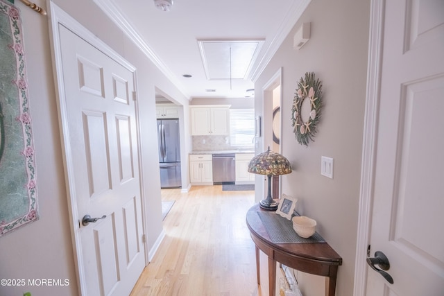 1920 Kenilworth Ct, Toms River, NJ 08753 - hallway featuring attic access, light wood-style flooring, and ornamental molding