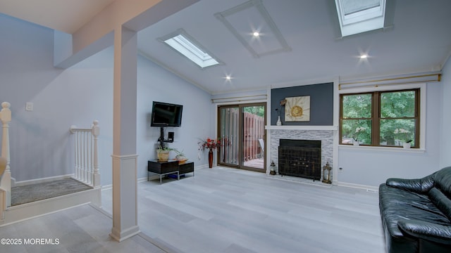 57 Chestnut Way, Manalapan, NJ 07726 - living area featuring a skylight, lofted ceiling, a fireplace, wood finished floors, and recessed lighting