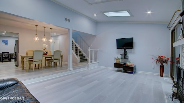 57 Chestnut Way, Manalapan, NJ 07726 - living area featuring wood finished floors, stairway, and ornamental molding