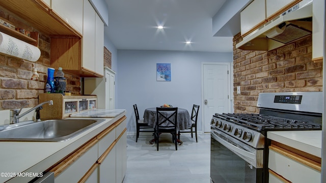 57 Chestnut Way, Manalapan, NJ 07726 - kitchen with gas range, range hood, white cabinetry, recessed lighting, and brick wall