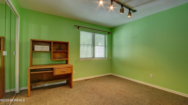 57 Chestnut Way, Manalapan, NJ 07726 - unfurnished bedroom with rail lighting and carpet