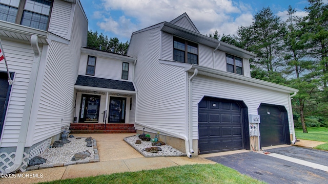 57 Chestnut Way, Manalapan, NJ 07726 - traditional-style house with a garage and asphalt driveway
