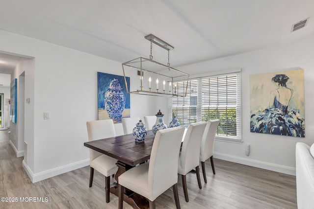 2254 S Chanticleer Ct, Toms River, NJ 08755 - dining space with a chandelier and light wood finished floors