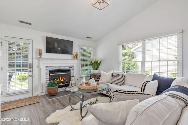 2254 S Chanticleer Ct, Toms River, NJ 08755 - living room with wood finished floors, lofted ceiling, and a high end fireplace