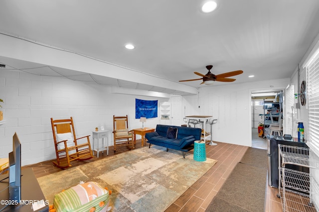 307 Webster Ave, Seaside Heights, NJ 08751 - living room featuring a ceiling fan, recessed lighting, concrete block wall, and wood finished floors