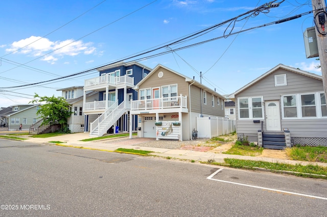 307 Webster Ave, Seaside Heights, NJ 08751 - view of front of property featuring stairs, entry steps, a balcony, and a garage