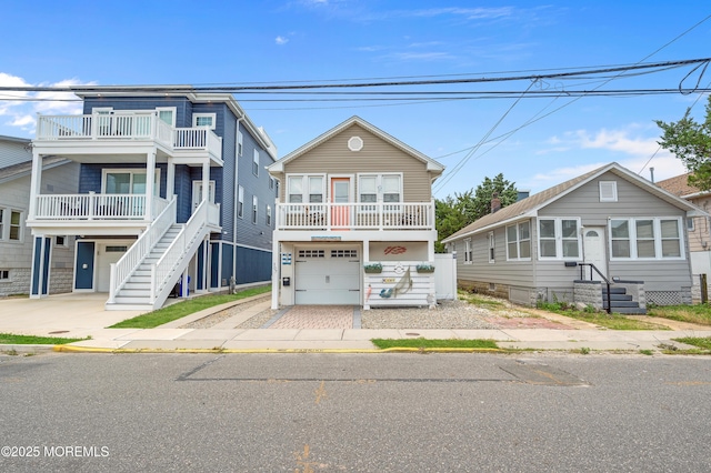 307 Webster Ave, Seaside Heights, NJ 08751 - beach home featuring driveway, a balcony, and an attached garage