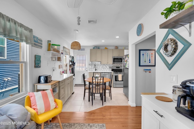307 Webster Ave, Seaside Heights, NJ 08751 - kitchen featuring appliances with stainless steel finishes, healthy amount of natural light, backsplash, light countertops, and recessed lighting