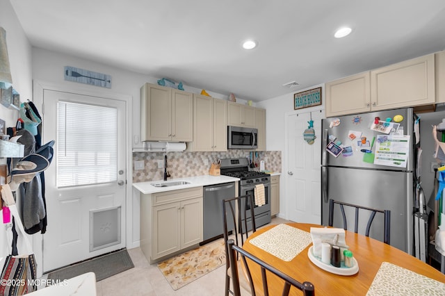 307 Webster Ave, Seaside Heights, NJ 08751 - kitchen with stainless steel appliances, light countertops, tasteful backsplash, light tile patterned floors, and recessed lighting