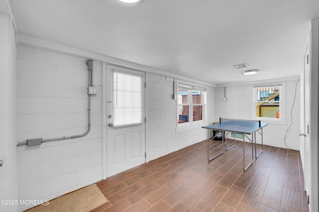 307 Webster Ave, Seaside Heights, NJ 08751 - foyer with dark wood-type flooring, concrete block wall, and plenty of natural light