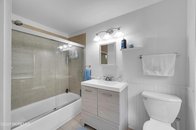 307 Webster Ave, Seaside Heights, NJ 08751 - bathroom featuring vanity, shower / bath combination with glass door, wainscoting, and tile patterned floors