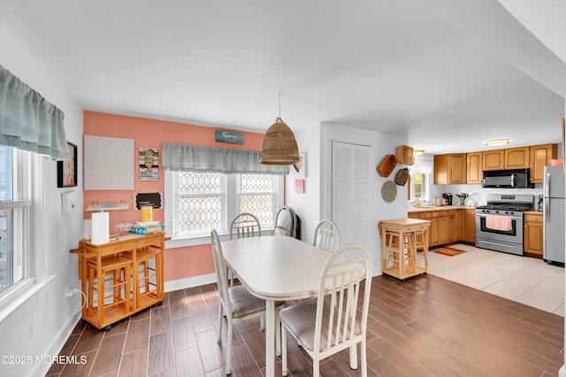 307 Webster Ave, Seaside Heights, NJ 08751 - dining room featuring plenty of natural light and wood tiled floors