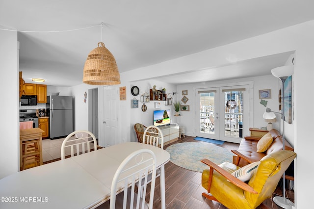 307 Webster Ave, Seaside Heights, NJ 08751 - dining area with french doors and light wood-style floors