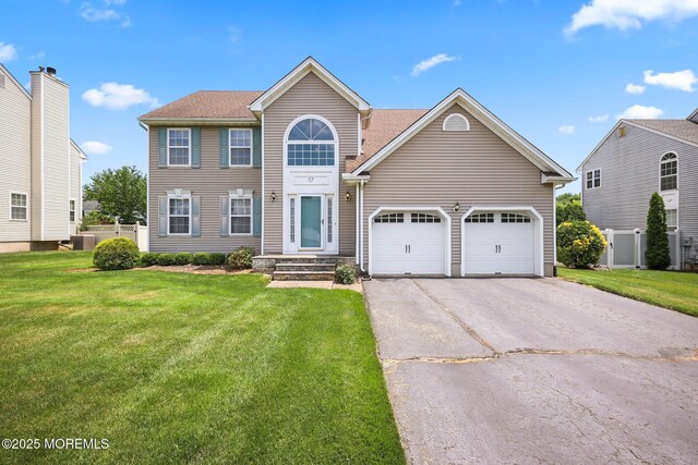 57 High Pointe Way, Matawan, NJ 07747 - colonial home with asphalt driveway and a garage