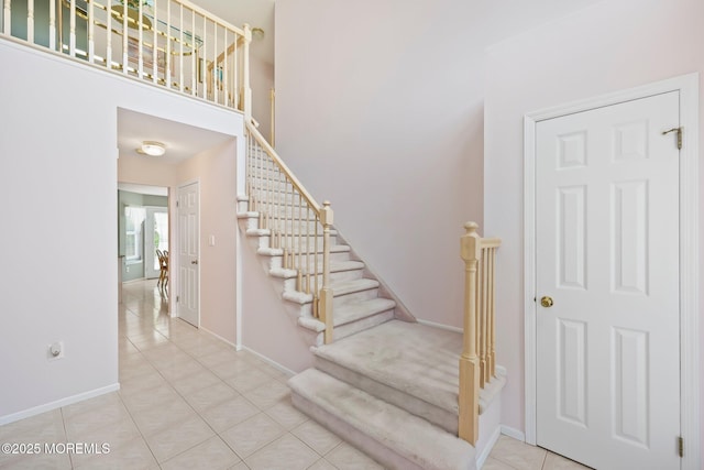 57 High Pointe Way, Matawan, NJ 07747 - stairway featuring tile patterned floors and a high ceiling